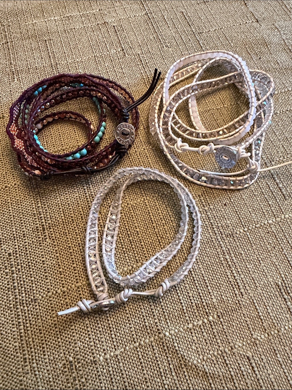 Three Victoria Emerson wrap bracelets in brown, turquoise, white and light blue